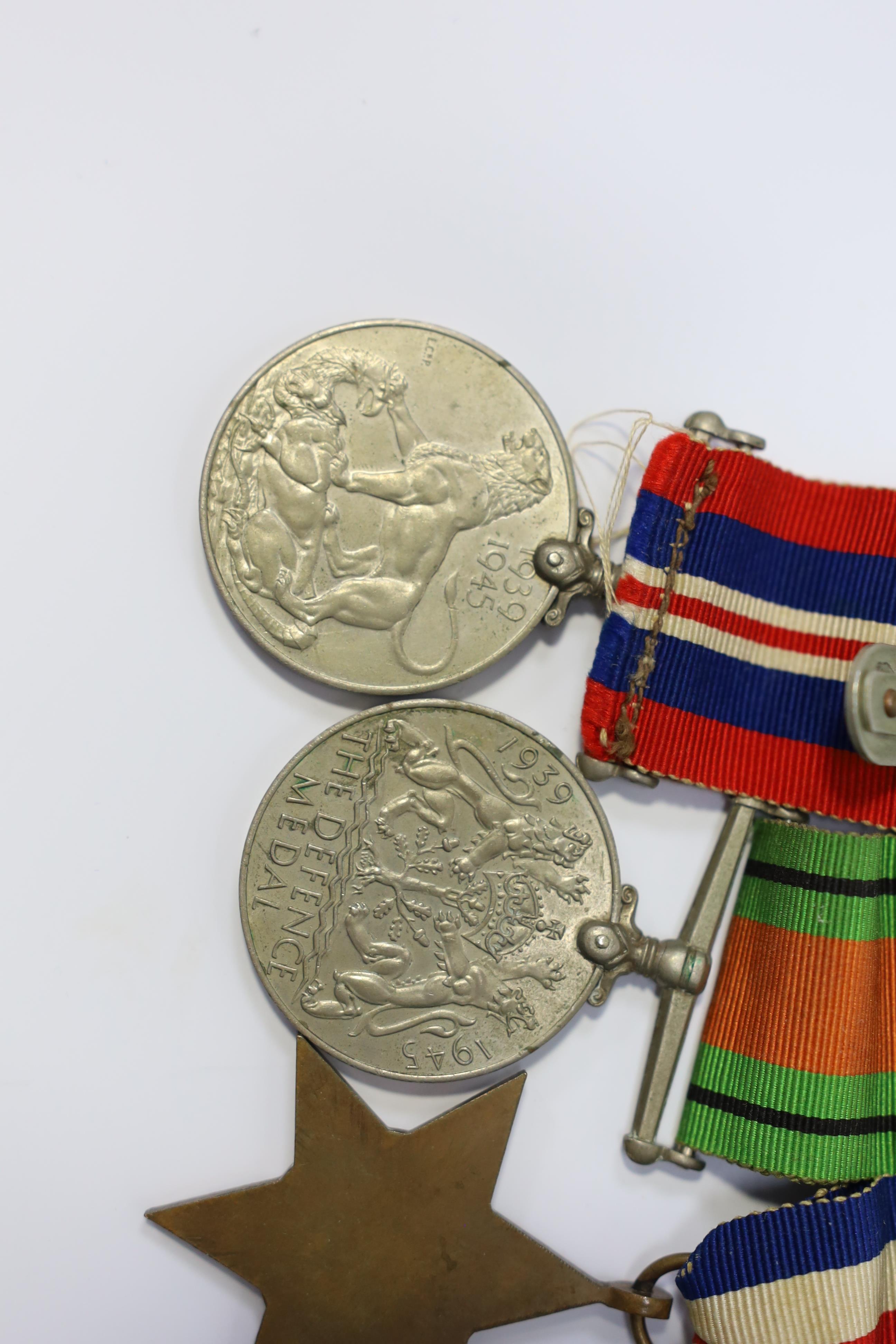 A WWII medal group awarded to Pte. J. Langridge S. Staff, comprising; a General Service Medal with two bars for Palestine and Palestine 1945-48, stamped to the edge with the recipient’s details, together with a 1939-45 S